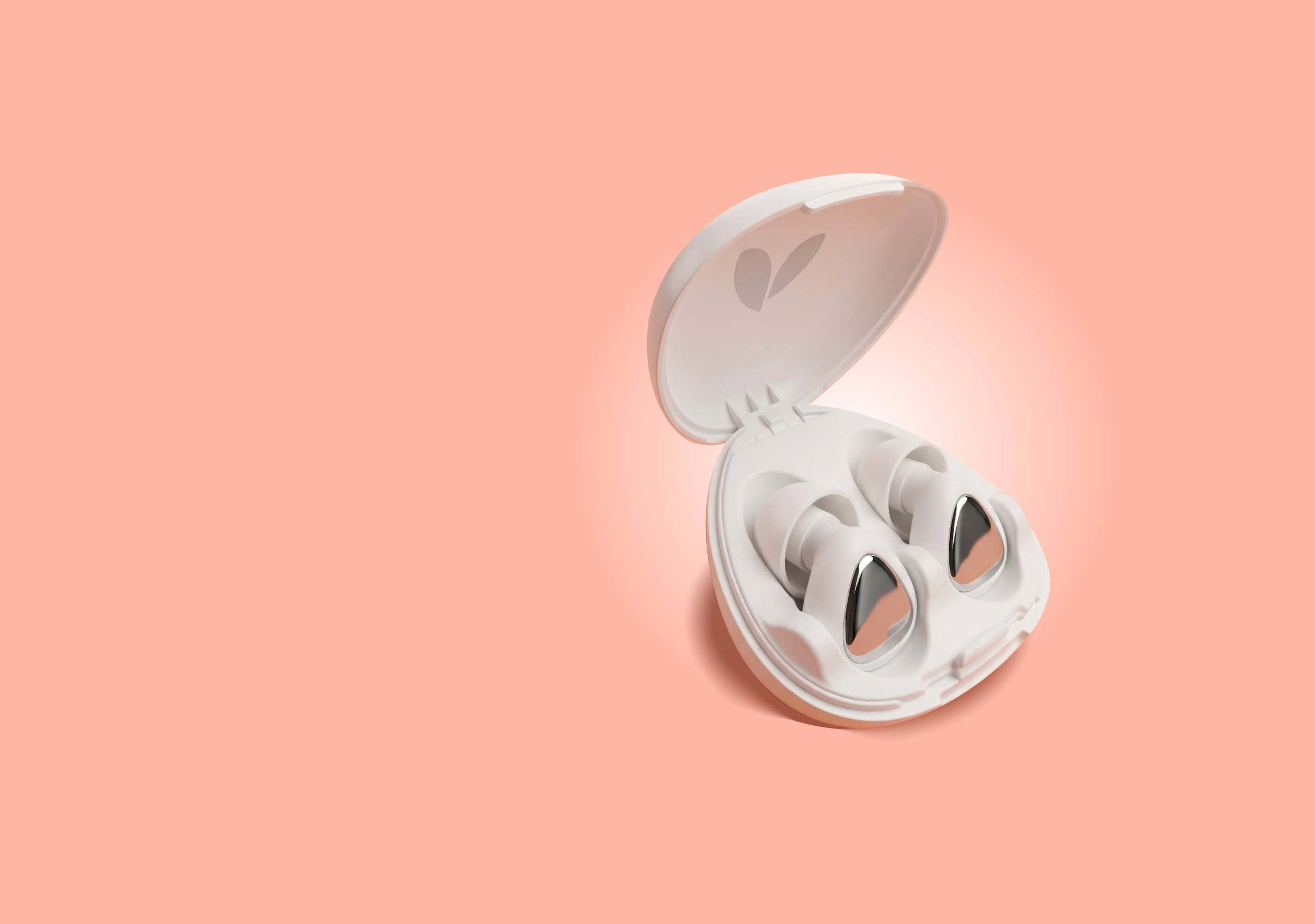 White earplugs in an open case on a peach background